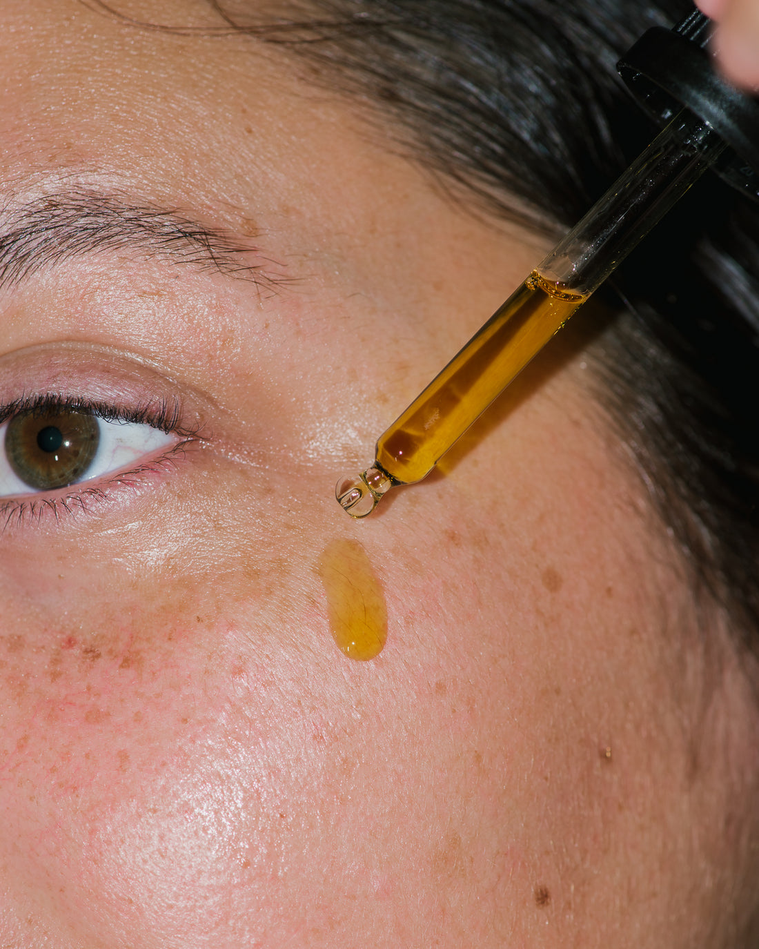 Close up of Active Botanical Serum on skin.