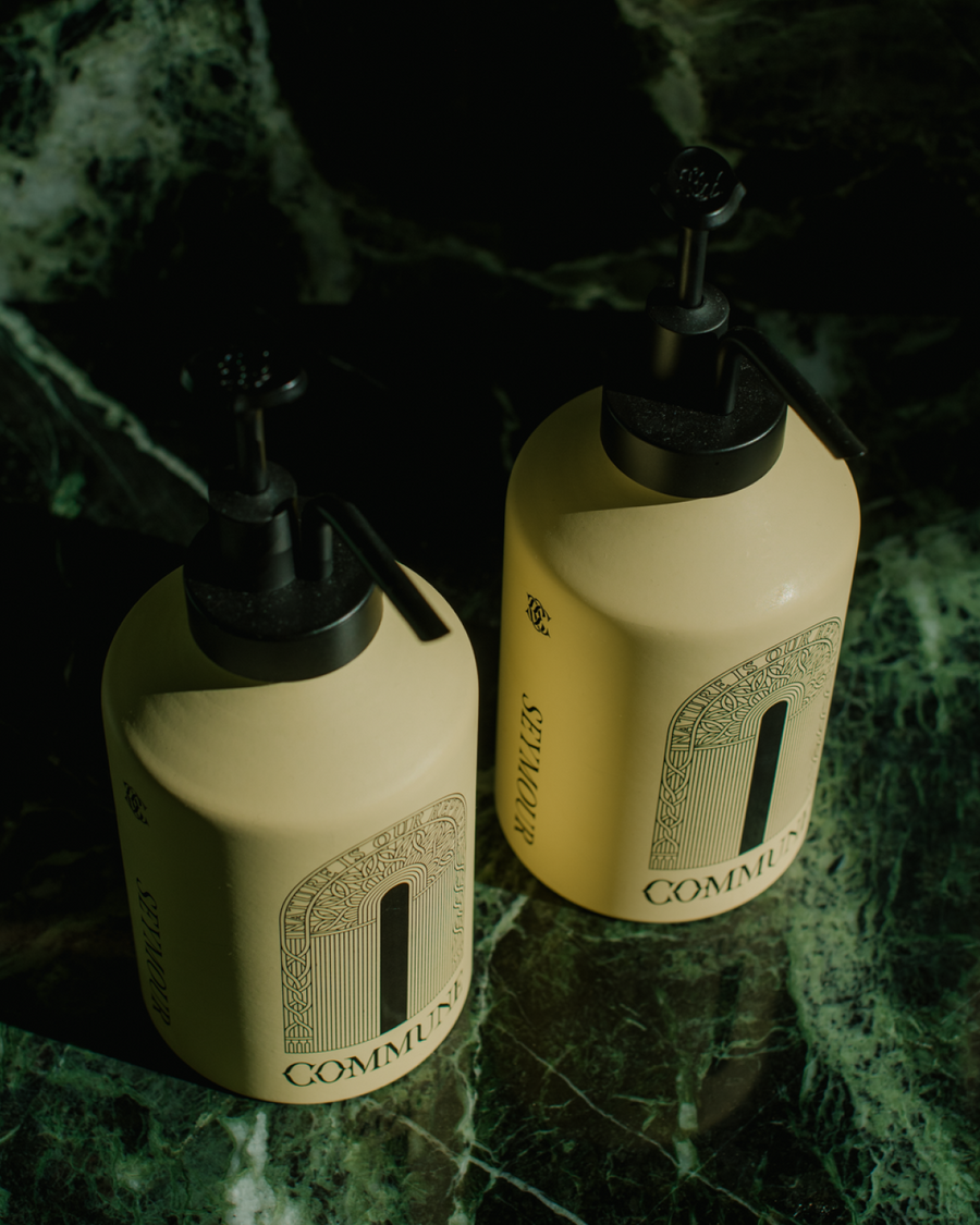 Commune Hand Cream + Hand Wash bottles on marble counter - Formula Fig