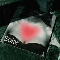 Soke Chest Mask packaging on marble table.