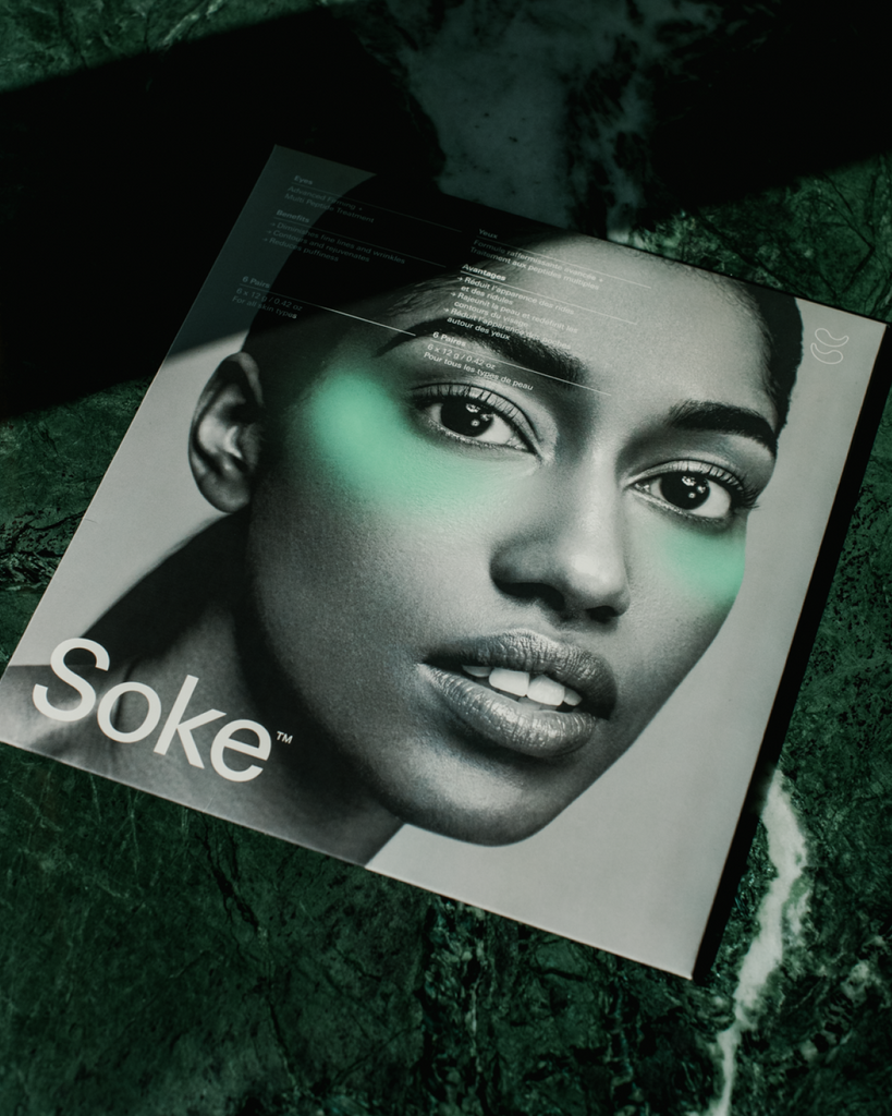 Soke Eye Treatment Masks in packaging on marble table.