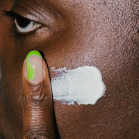 Close up of Black Girl Suncreen SPF on skin. 