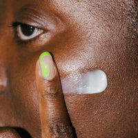 Close up of Anti-Aging Repair Moisturizer on skin.