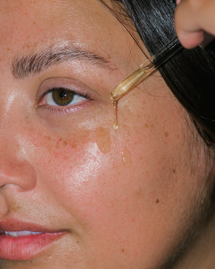 Close up of Concentrated Firming Serum on skin. 