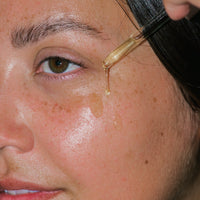 Close up of Concentrated Firming Serum on skin. 