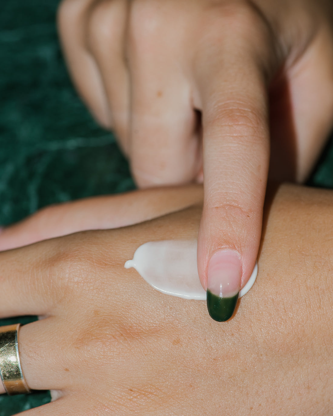 Close up of Intense Brightening Cream on skin.