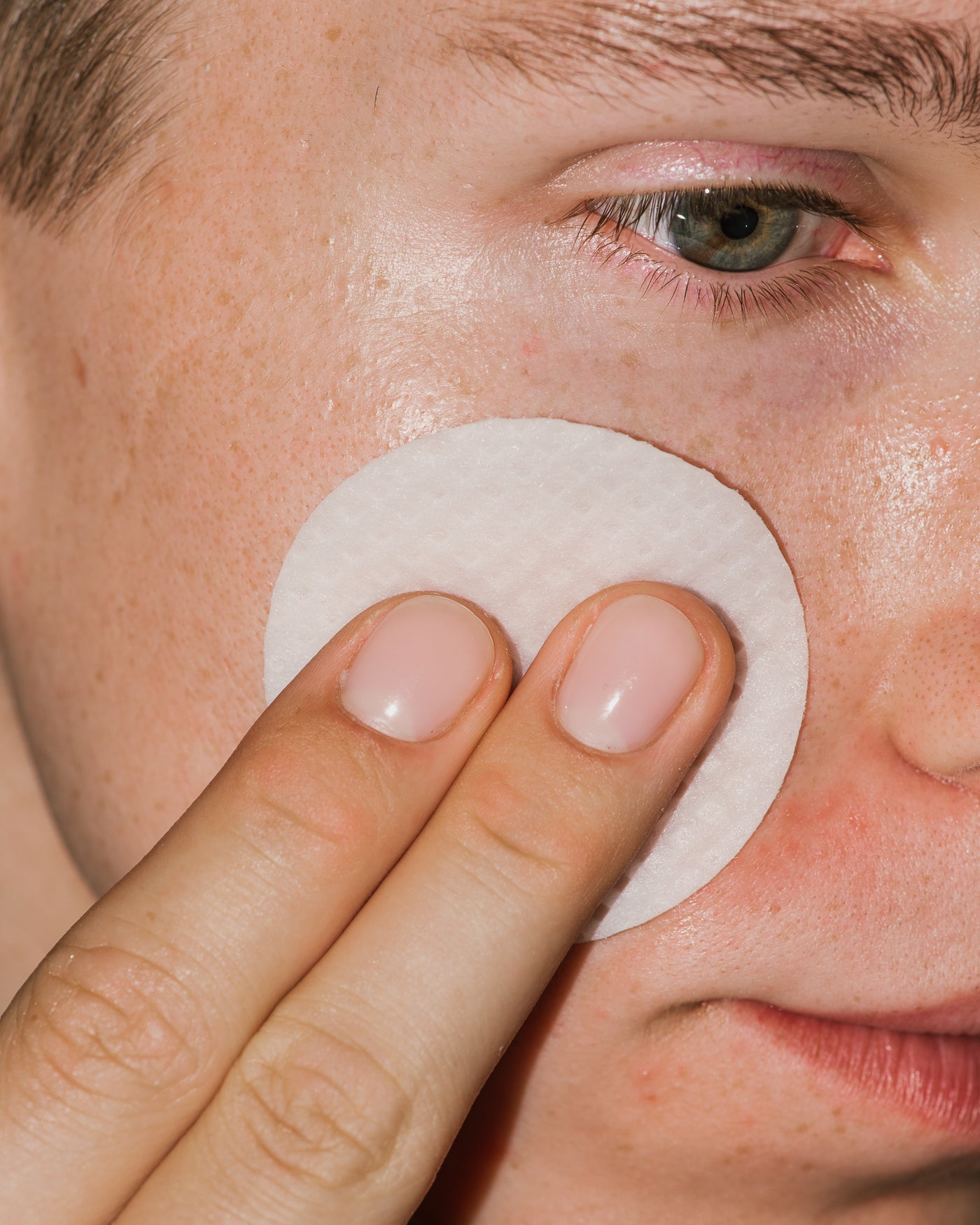 Close up of Micro Peel Peptide Pads on skin.