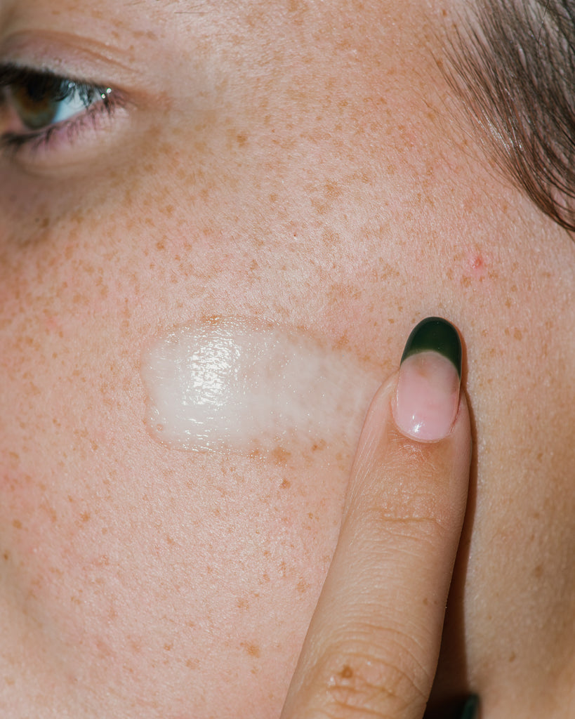 Close up of Grand Amino Cushion Cream on skin.