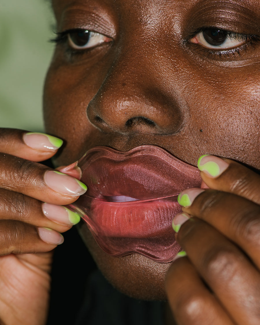 Close up of Collagen-Infused Lip Mask pack on skin.
