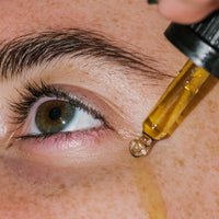Close up of Bl+C Pimples Serum Concentrate on skin.