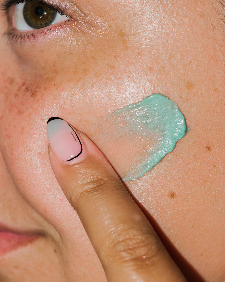 Close up of Diamant Bleu Clarifying Cream on skin.