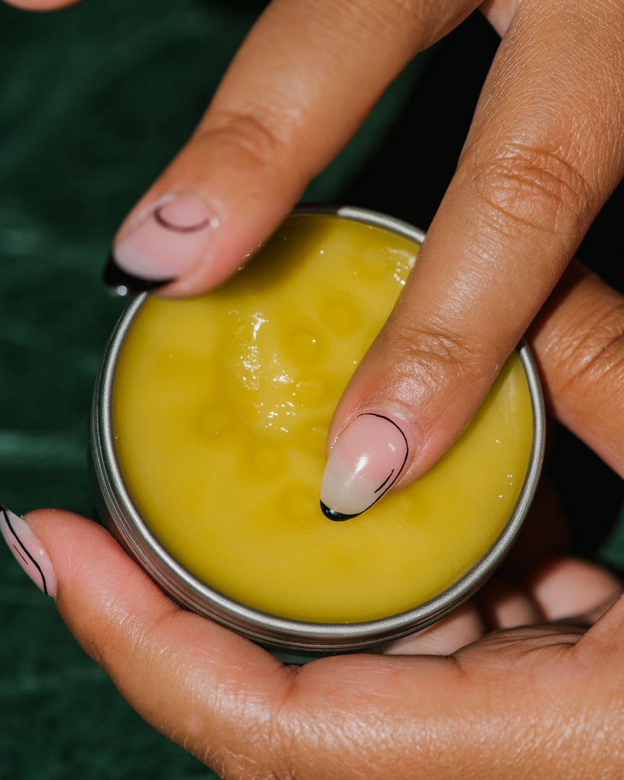 Close up of KALKÁY Healing Salve tin.