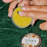 Close up og PÁ7PAWTN Nettle and Arnica Sore Muscle Salve tin.