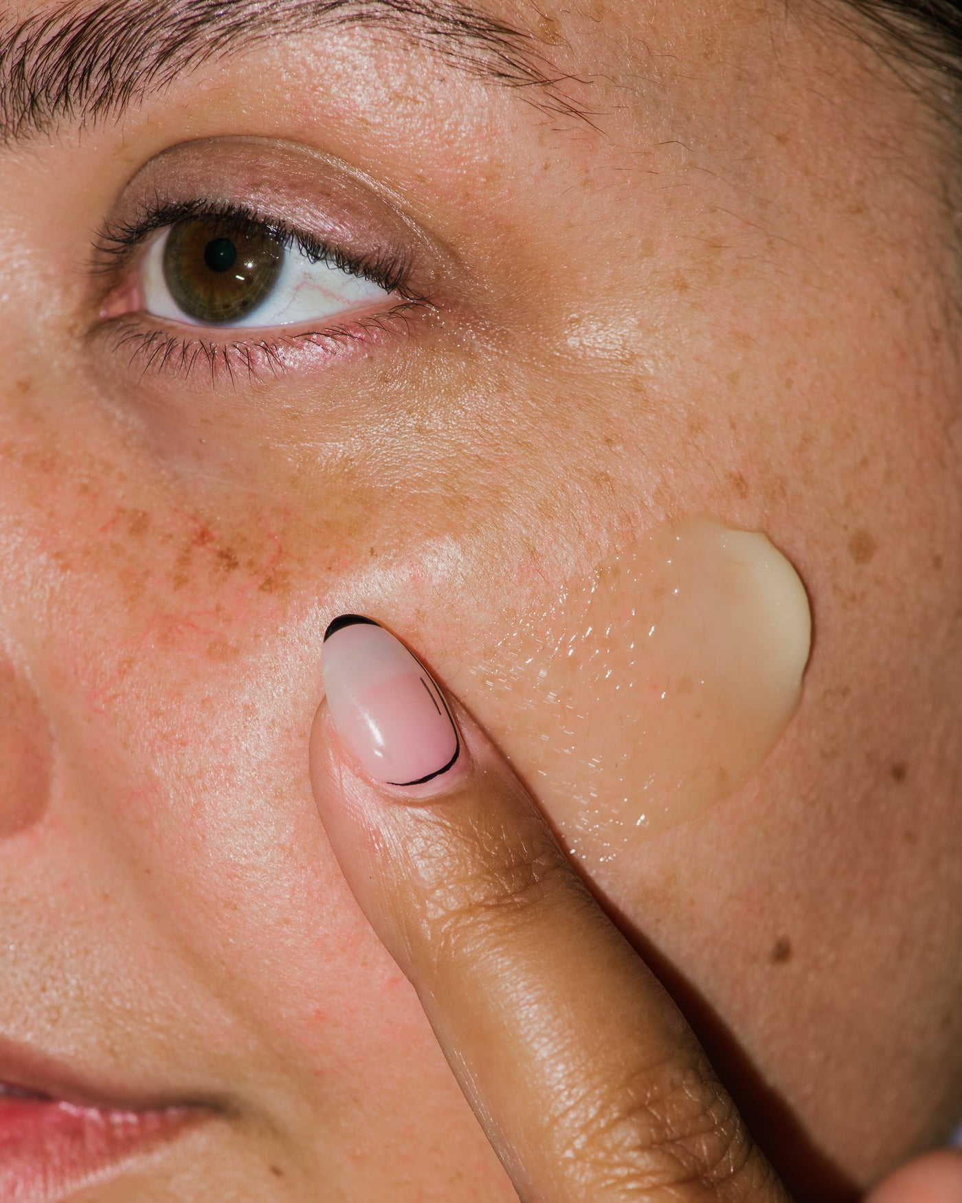Close up of Nourishing Botanical Facial Balm on skin.