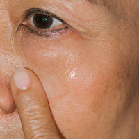 Close up of Restorative Age Defense Eye Crème on skin.